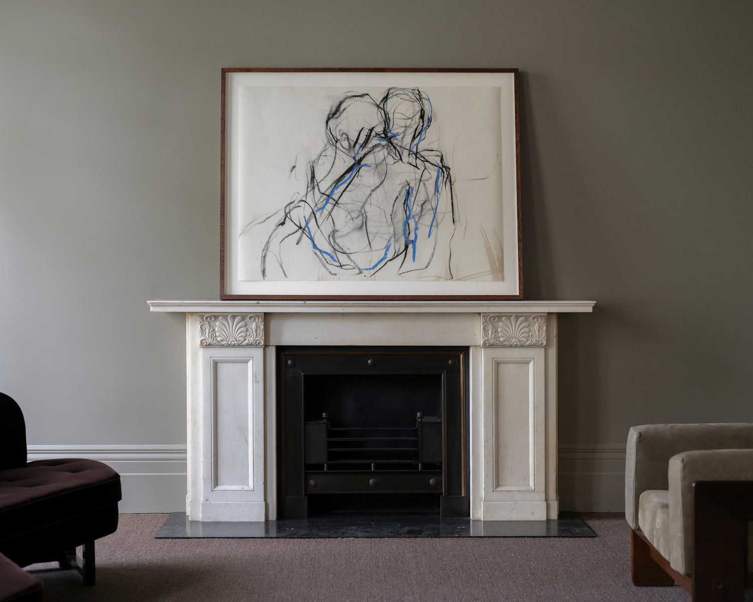 Print of 'Embrace' by artist Rosalie Watkins over fireplace with green wall
